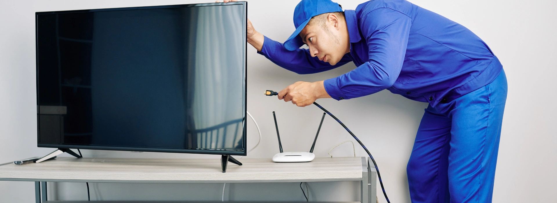 Technician installing cable TV